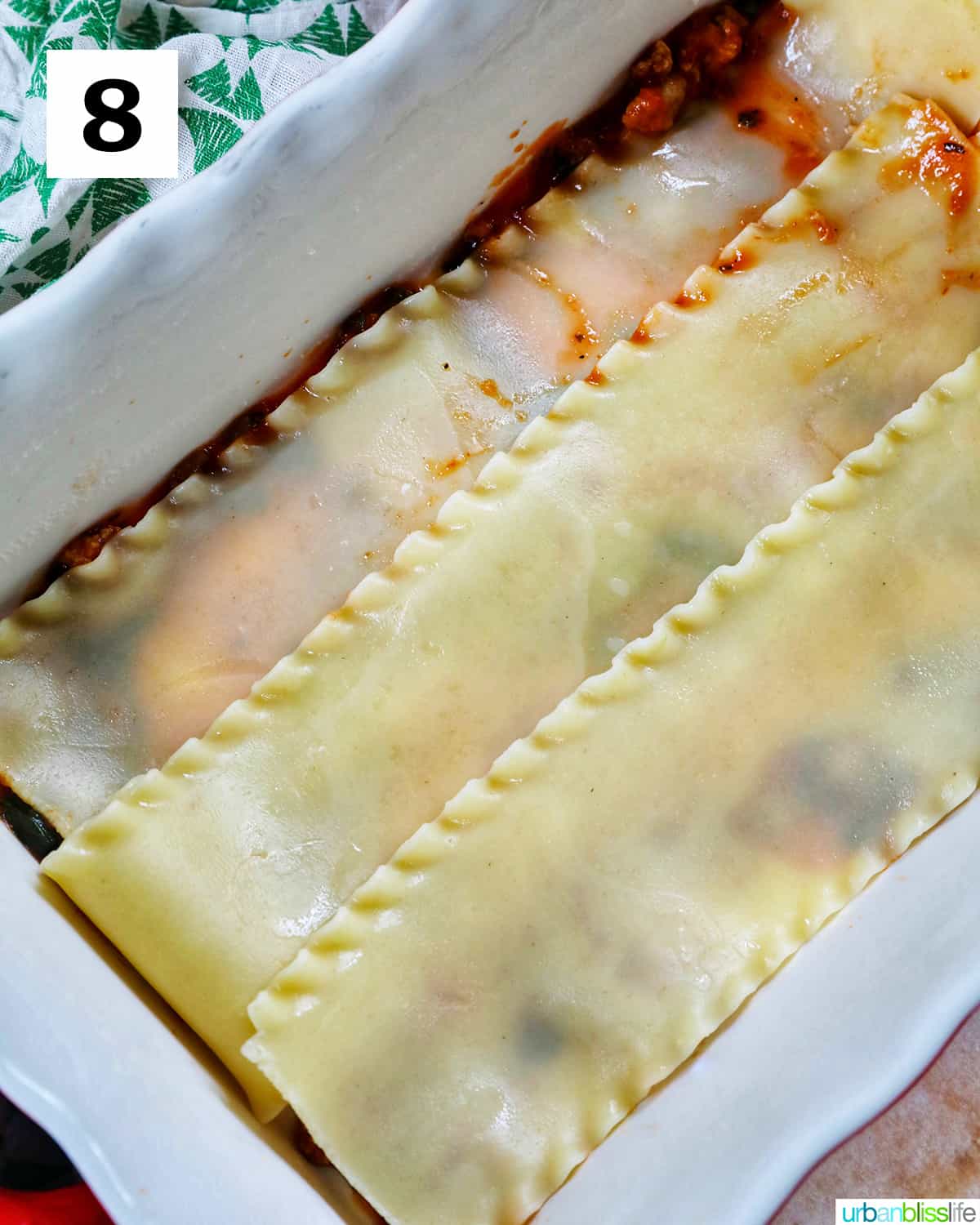 layer of cooked lasagna noodles added to a baking dish to make dairy free lasagna.