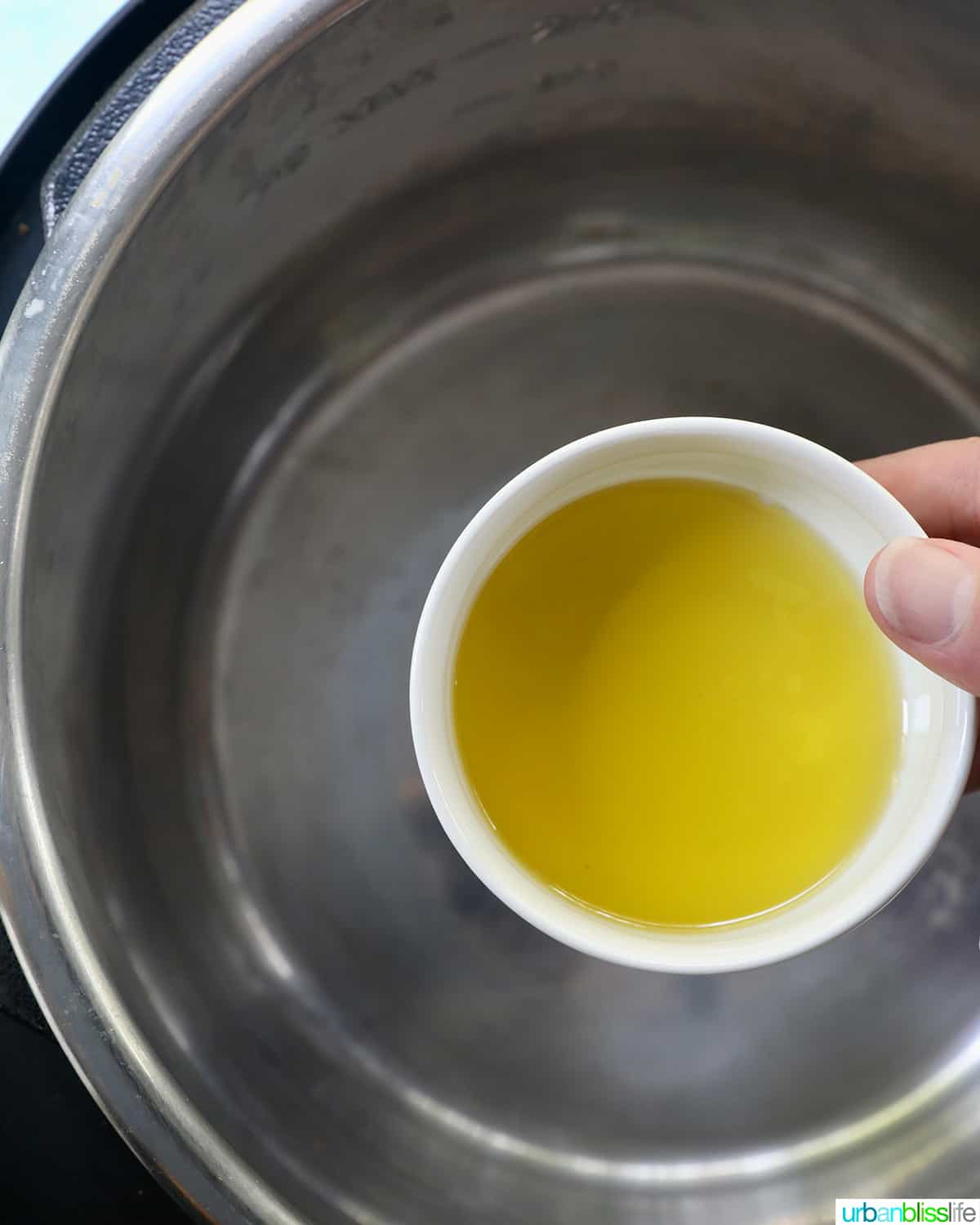 bowl of olive oil above the instant pot.