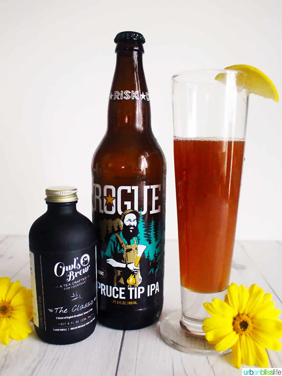 Owl's Brew tea for cocktails, Rogue Brewing Spruce Tip IPA, iced tea and beer cocktail with yellow flowers.