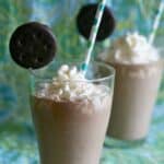 thin mint milkshakes with whipped cream and cookie.