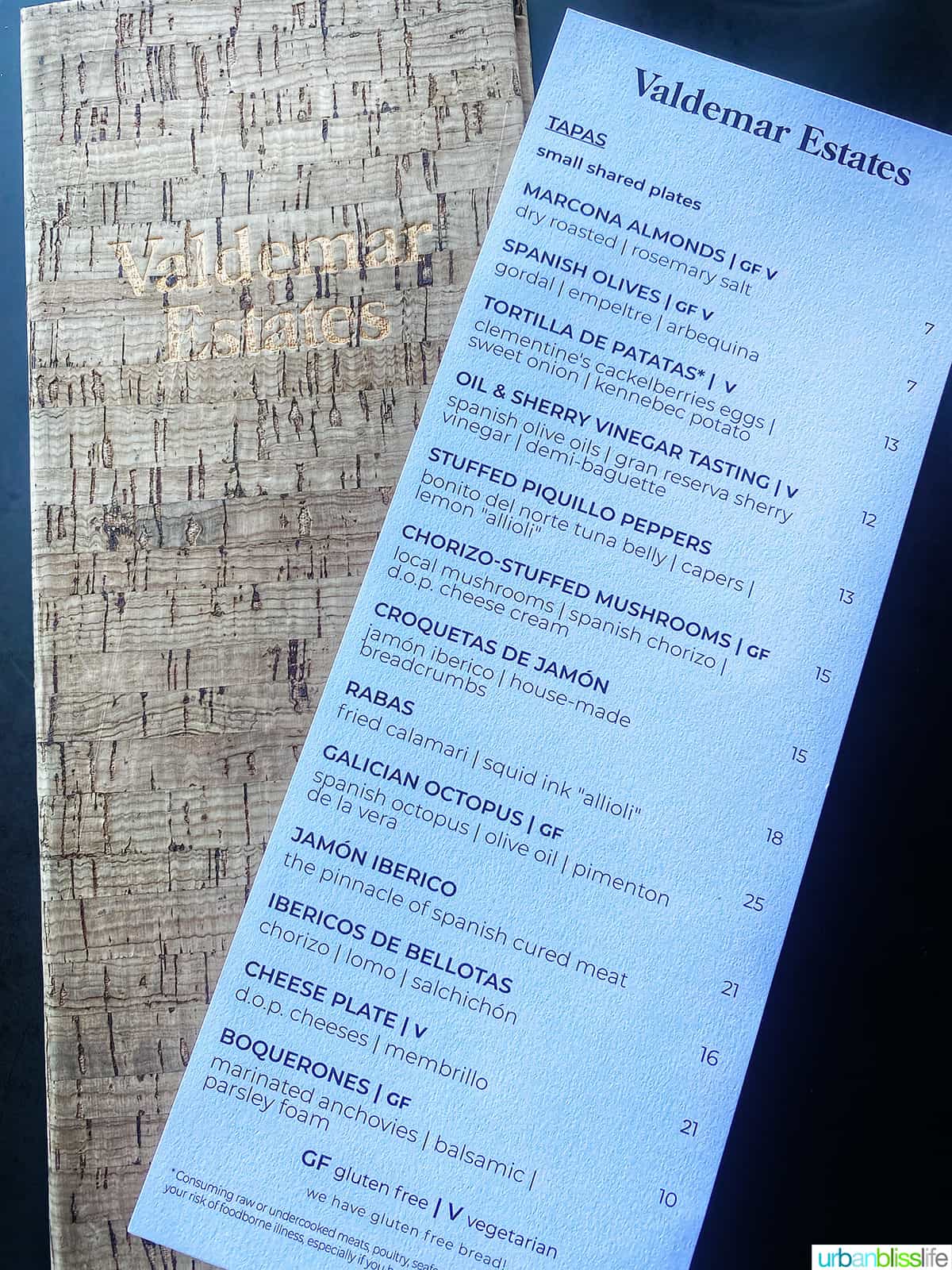 tapas menu on top of a cork menu cover at Valdemar Estates, a winery in Walla Walla.