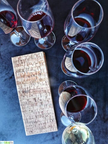 wine flights and tasting menu on a black table at Valdemar Estates, a winery in Walla Walla