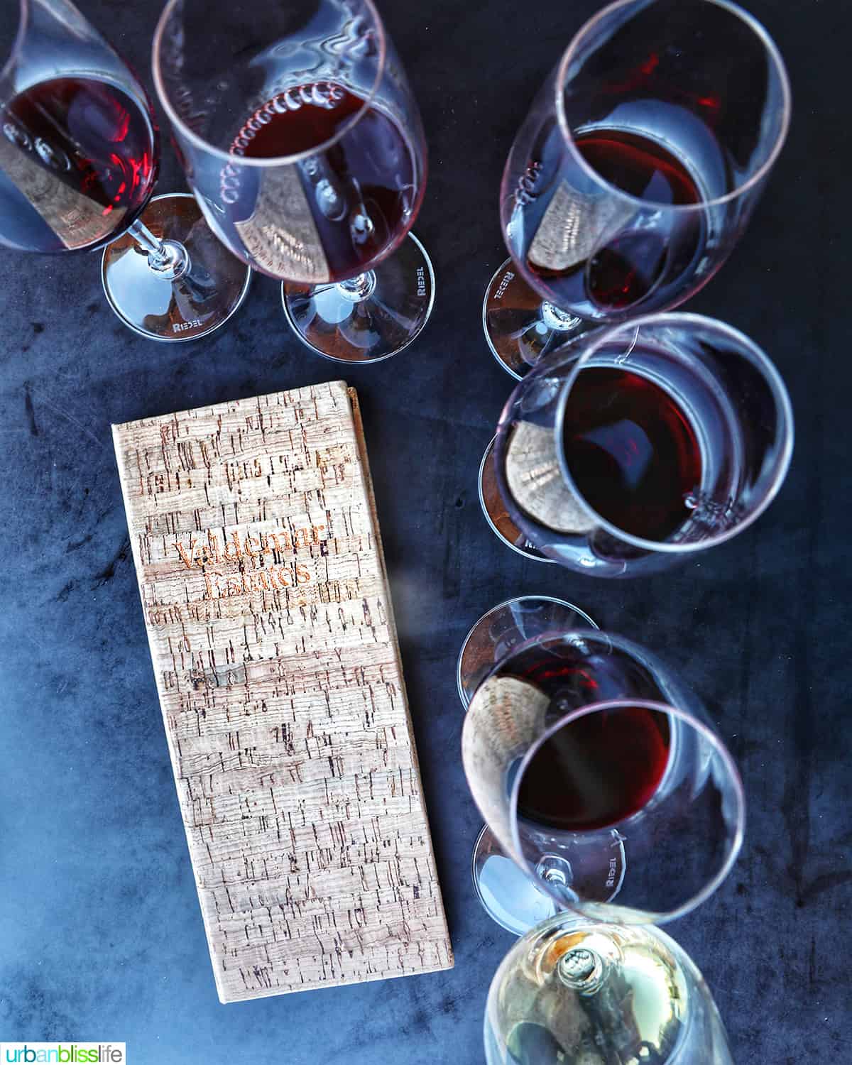 wine flights and tasting menu on a black table at Valdemar Estates, a winery in Walla Walla