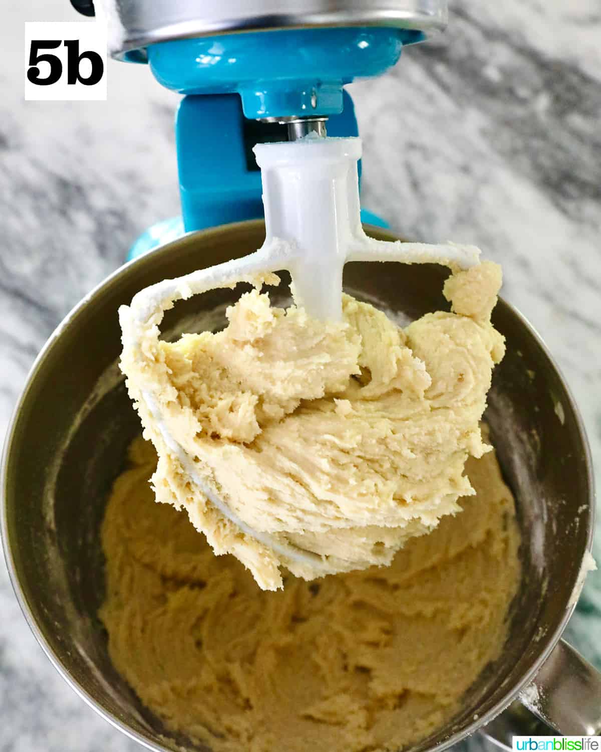 stand mixer with paddle attachment with key lime cookie batter.