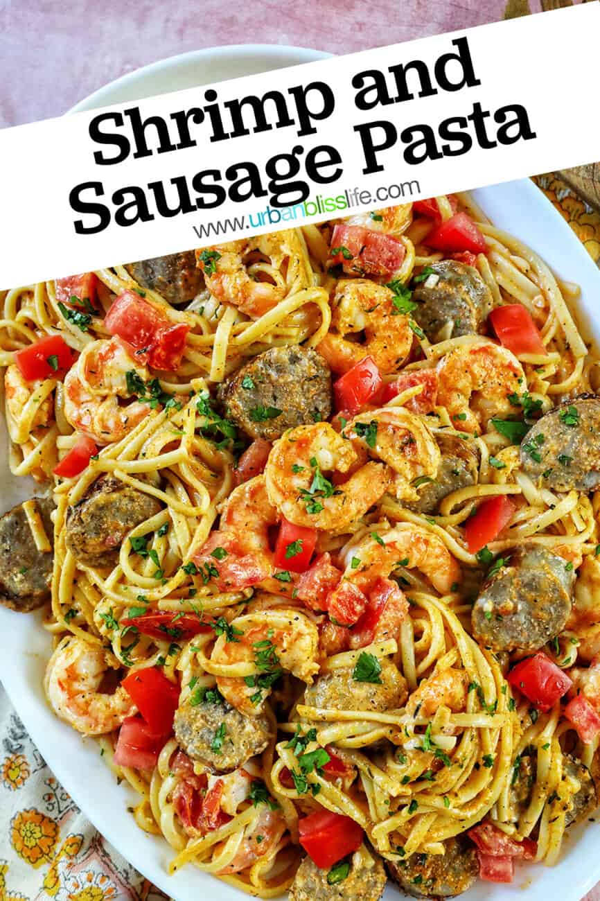 Shrimp and Sausage Pasta in a large serving platter with title text overlay.