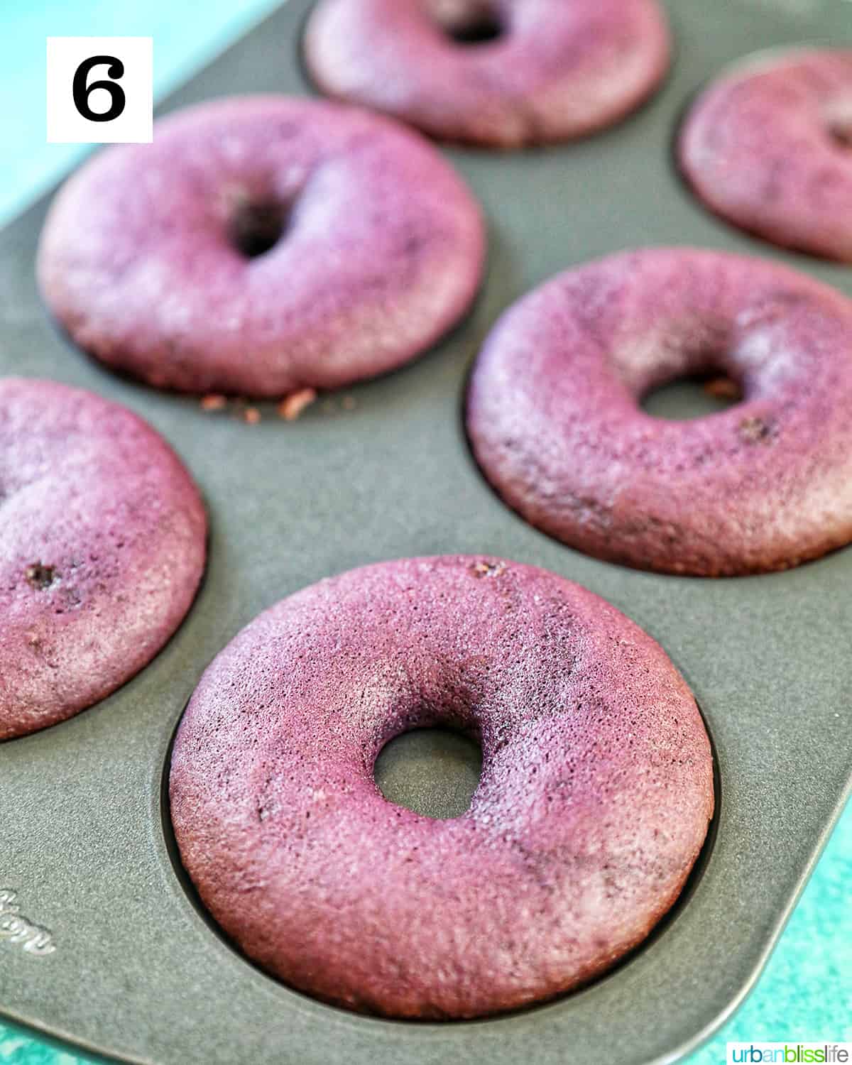 purple ube donuts baked in a donut pan.