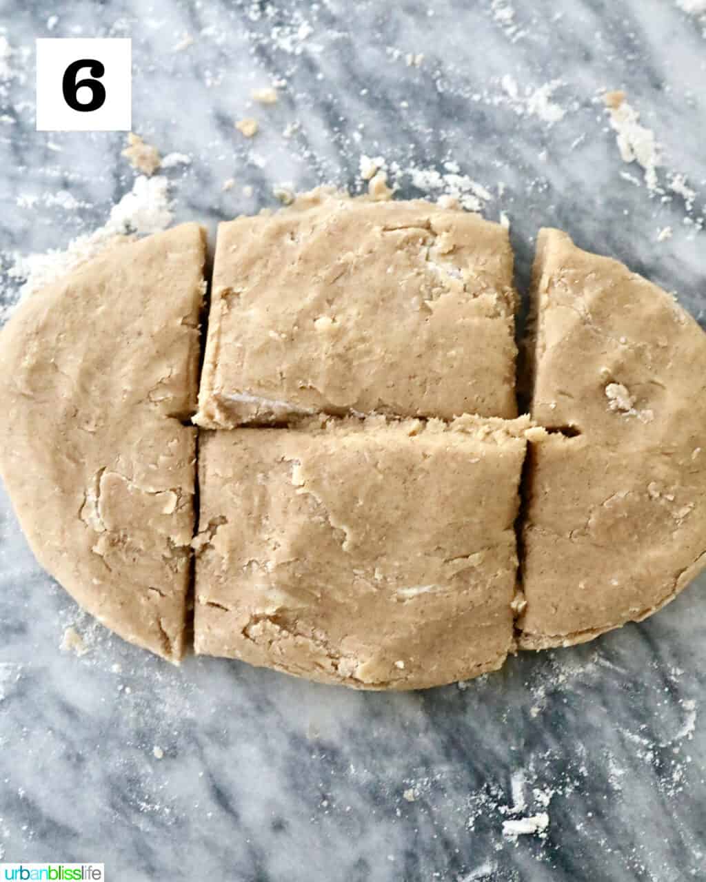 dividing cookie dough into four pieces.