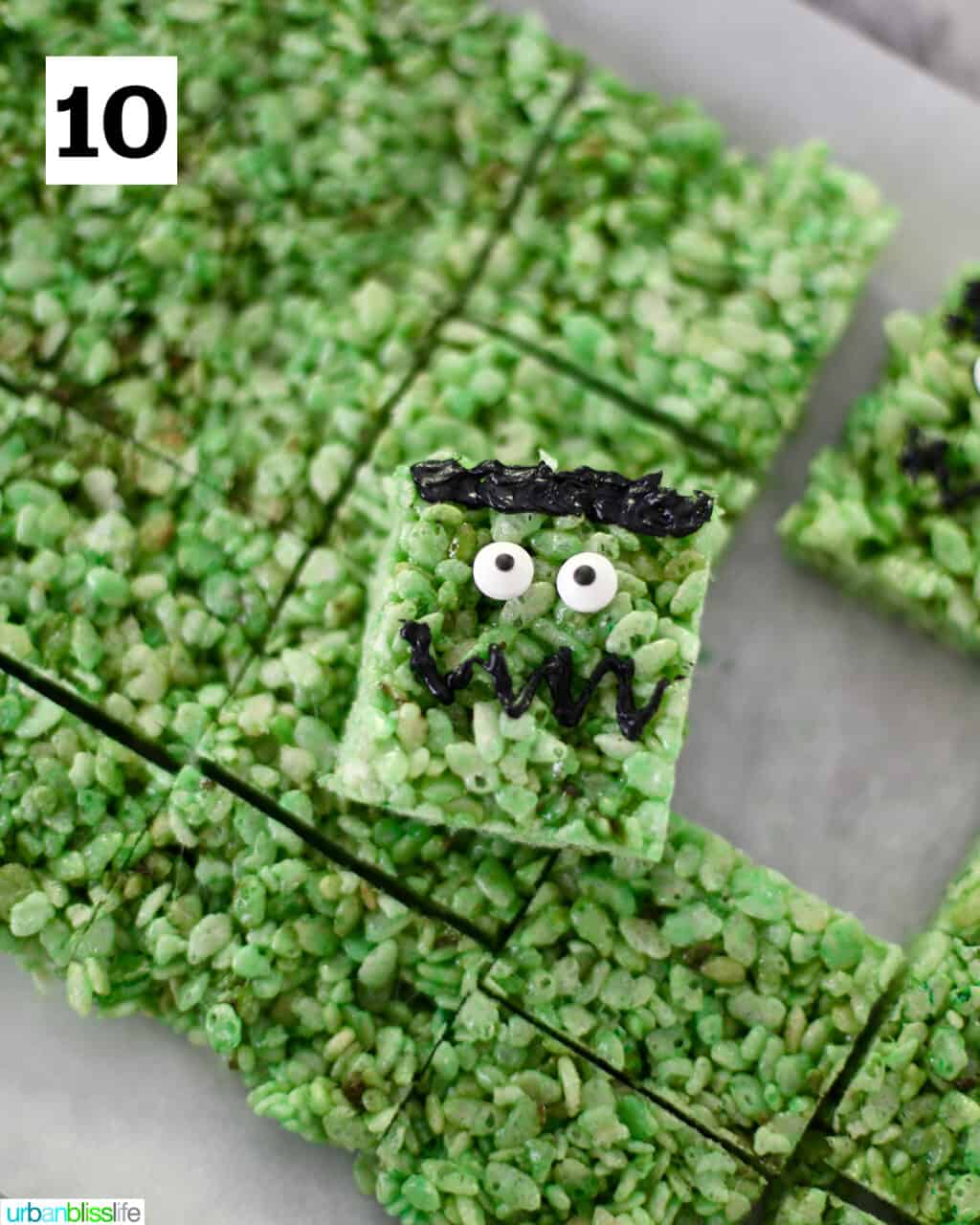 one decorated Frankenstein Rice Krispie on top of the batch of treats