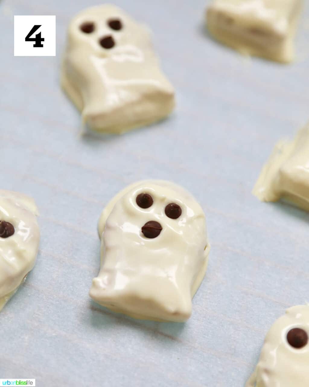 Nutter Butter cookies dipped in white chocolate with chocolate chips.