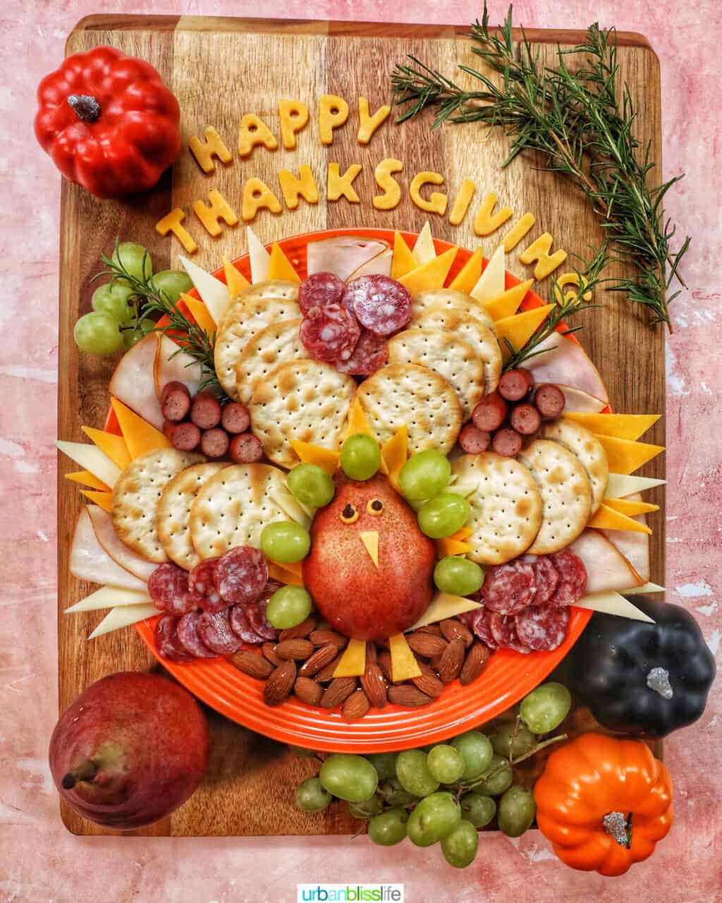 beautiful Thanksgiving turkey charcuterie board with cheese, meat, crackers, and fruit.