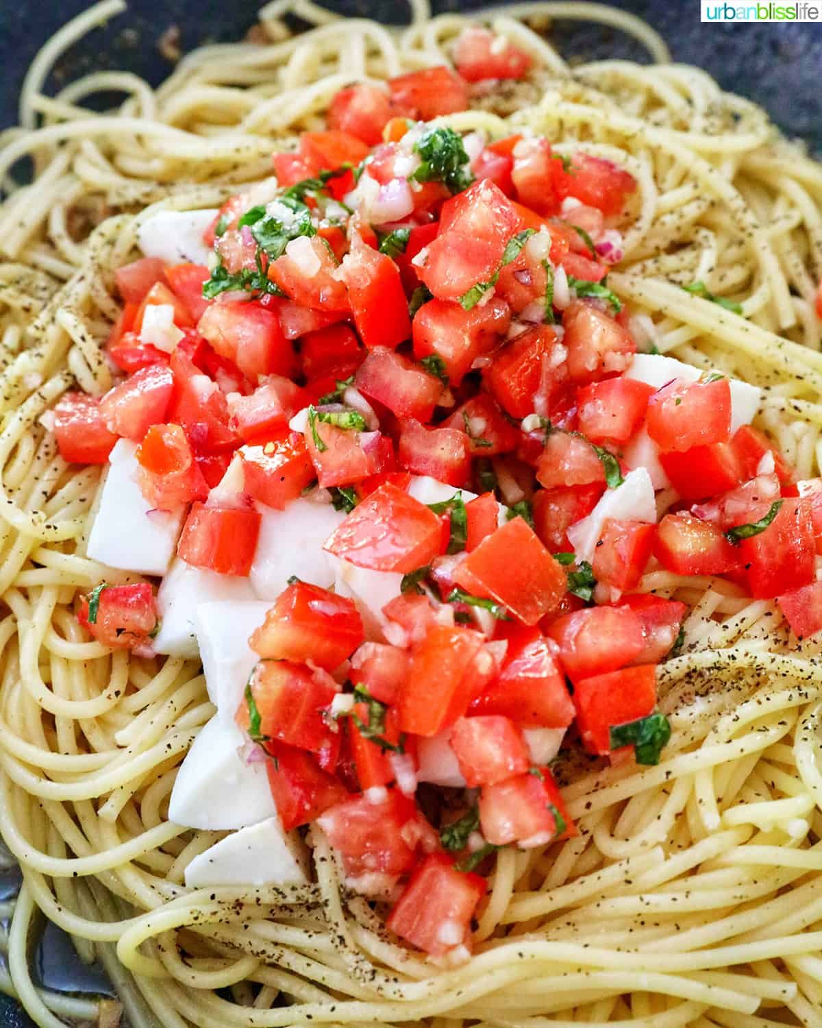 bruschetta pasta with tomatoes, basil, mozzarella cheese.