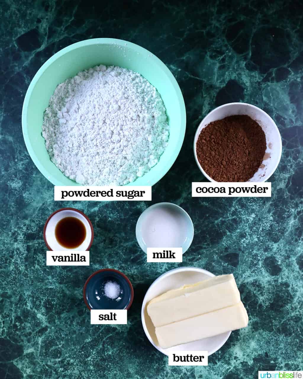 bowls of ingredients to make easy chocolate buttercream frosting.