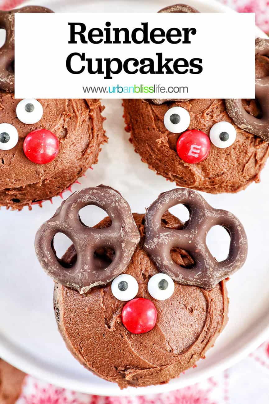 three reindeer cupcakes on a plate with title text overlay.