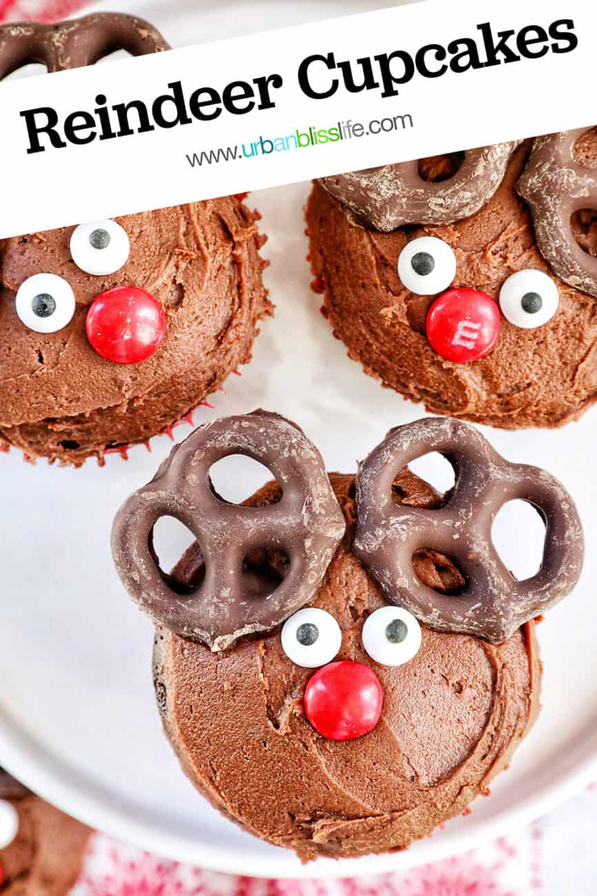 three reindeer cupcakes on a plate with title text overlay.