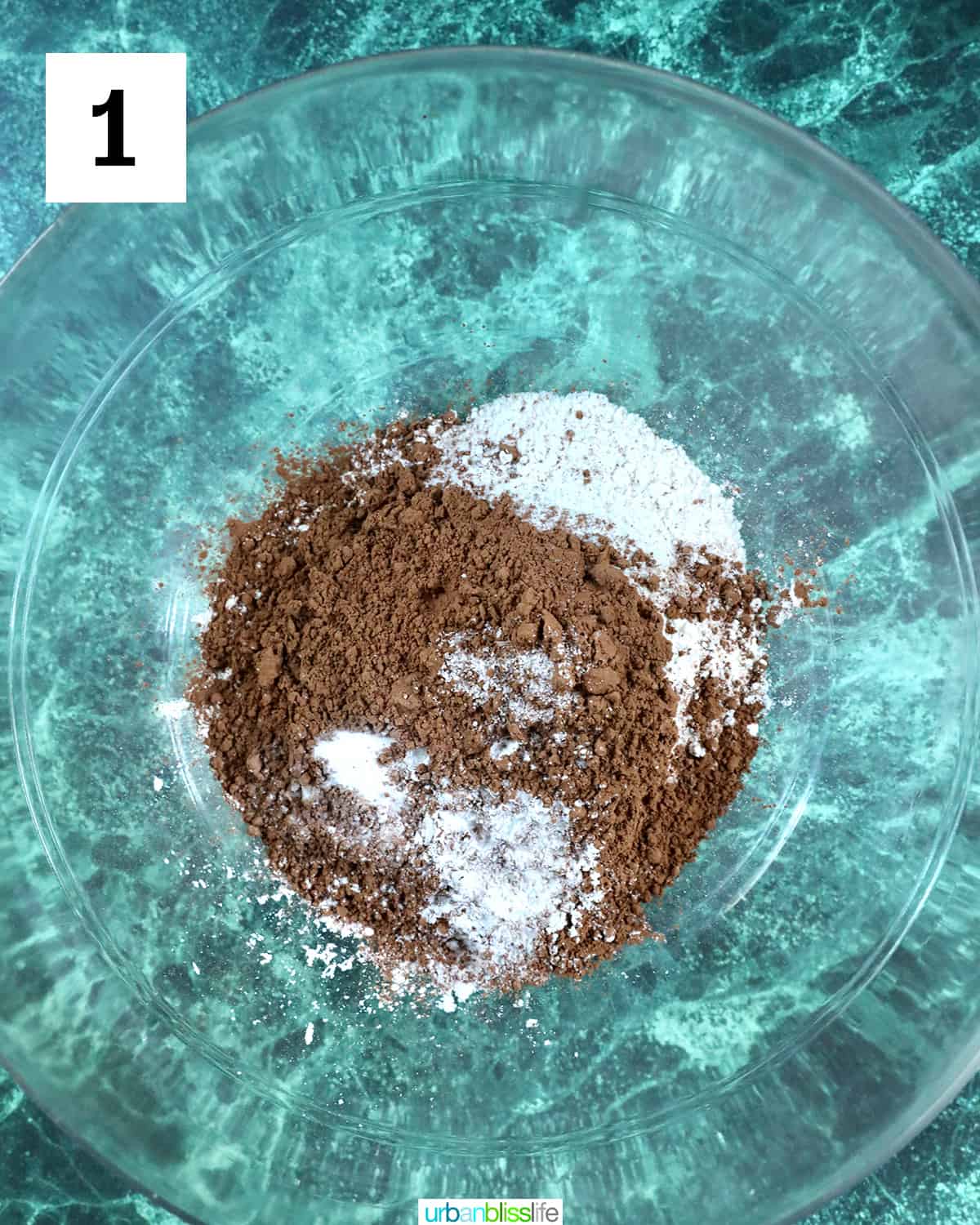 cocoa powder and other dry ingredients in a bowl to make chocolate cupcakes.