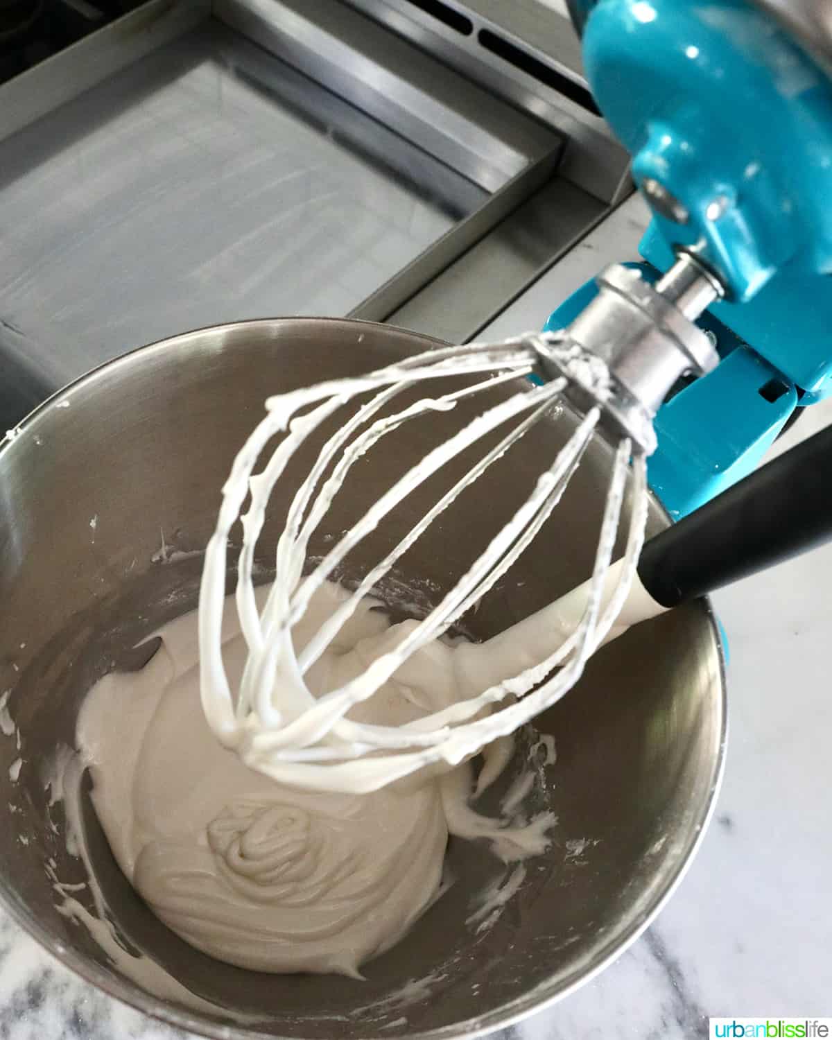 royal icing done mixing in a stand mixer.