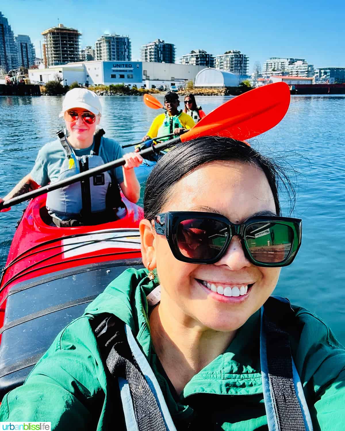 Marlynn and other journalists in a kayak on the Victoria Harbor.