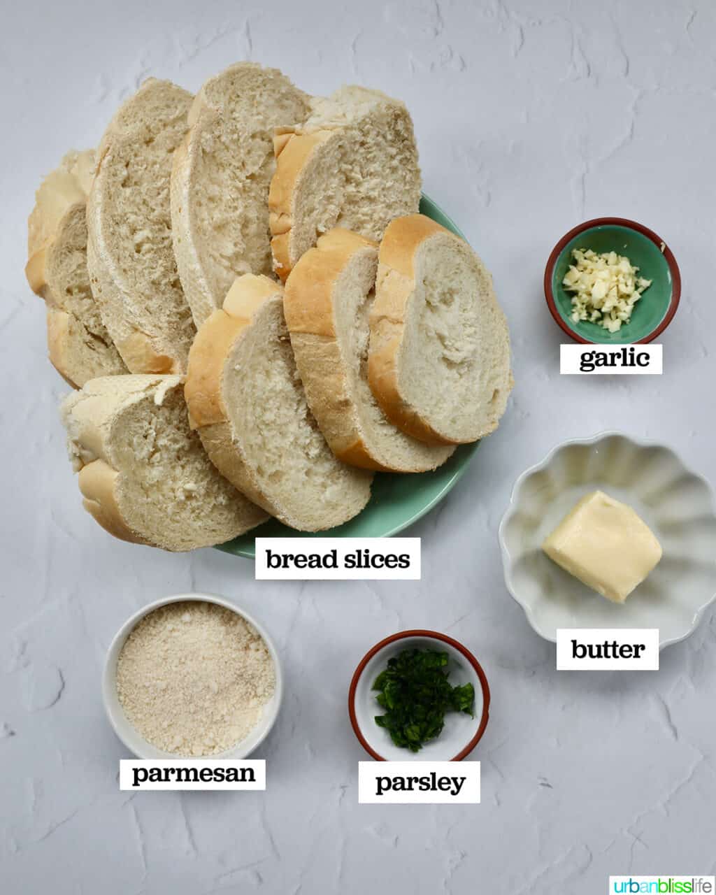 sliced French bread, parmesan cheese, parsley, butter, and garlic to make garlic bread.