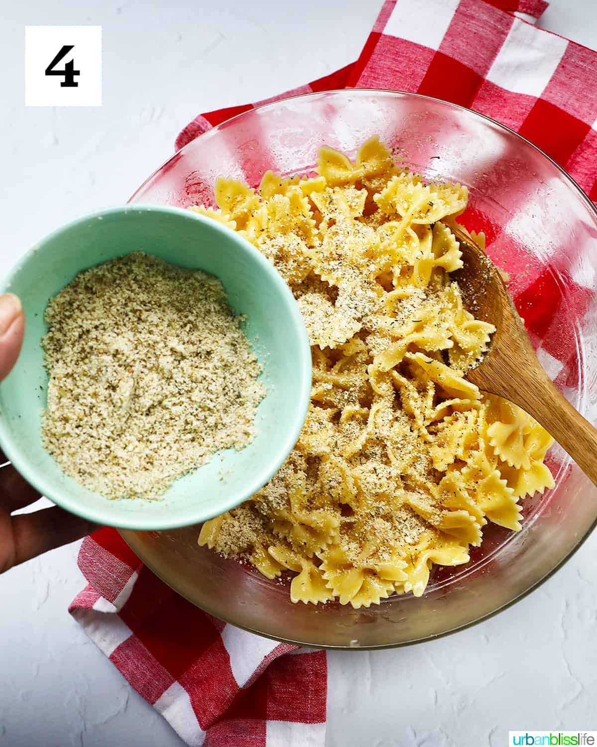 bowl of seasoning over Air Fryer Pasta Chips with a red and white checker napkin.