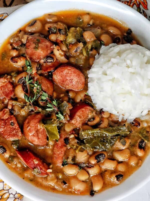Instant Pot black eyes peas with scoop of white rice in a white bowl.