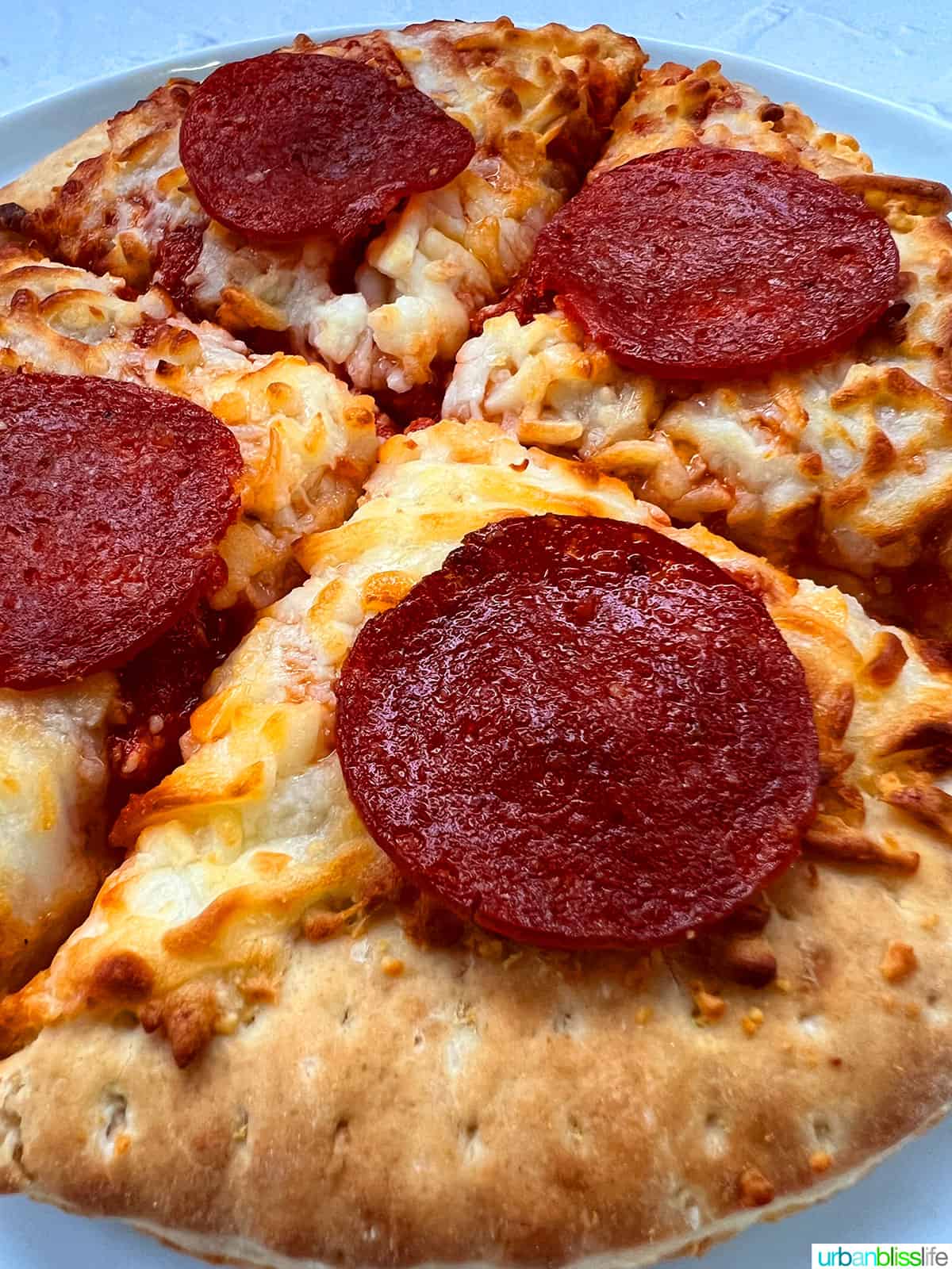 air fryer frozen pizza with pepperoni close up