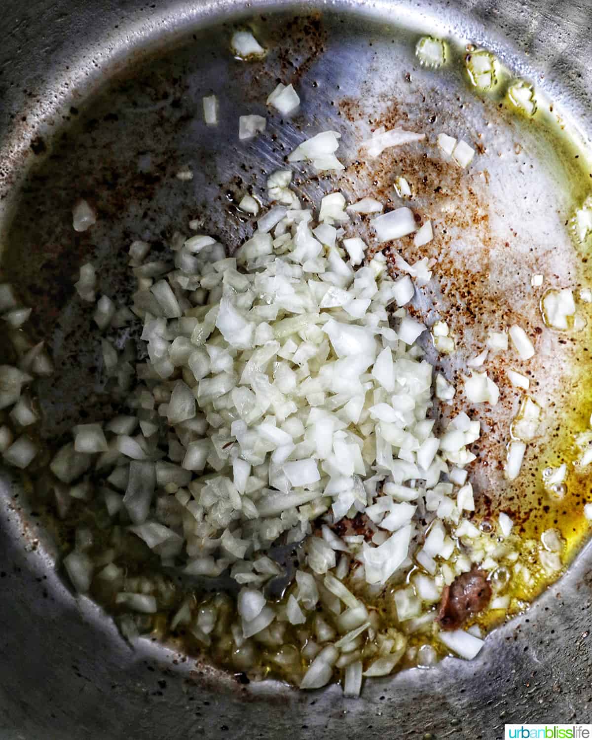 minced garlic and diced onions sauteing in an Instant Pot.