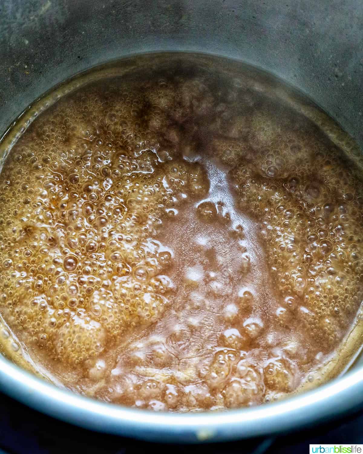 gravy bubbling and thickening in an Instant Pot.