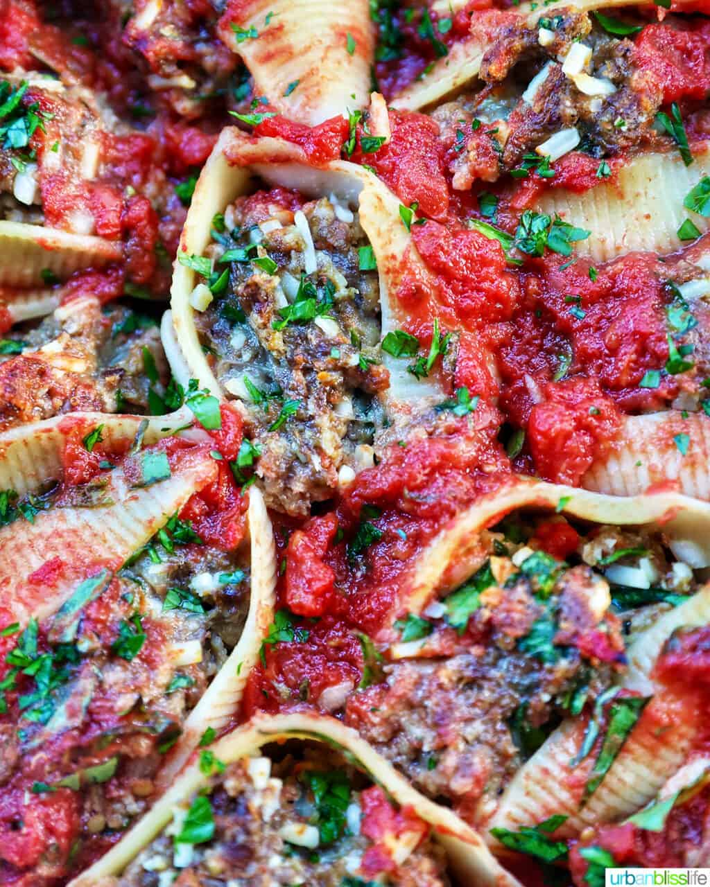 closeup of cooked stuffed shells with ground beef.