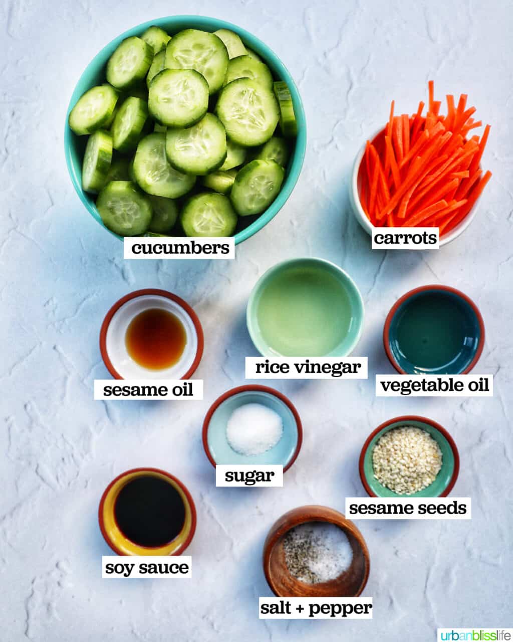 bowls of ingredients to make Asian Carrot Cucumber Salad.
