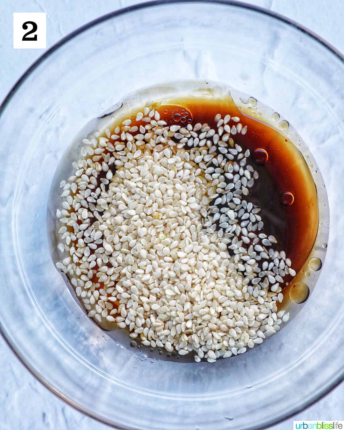 bowl of sauce and sesame seeds.