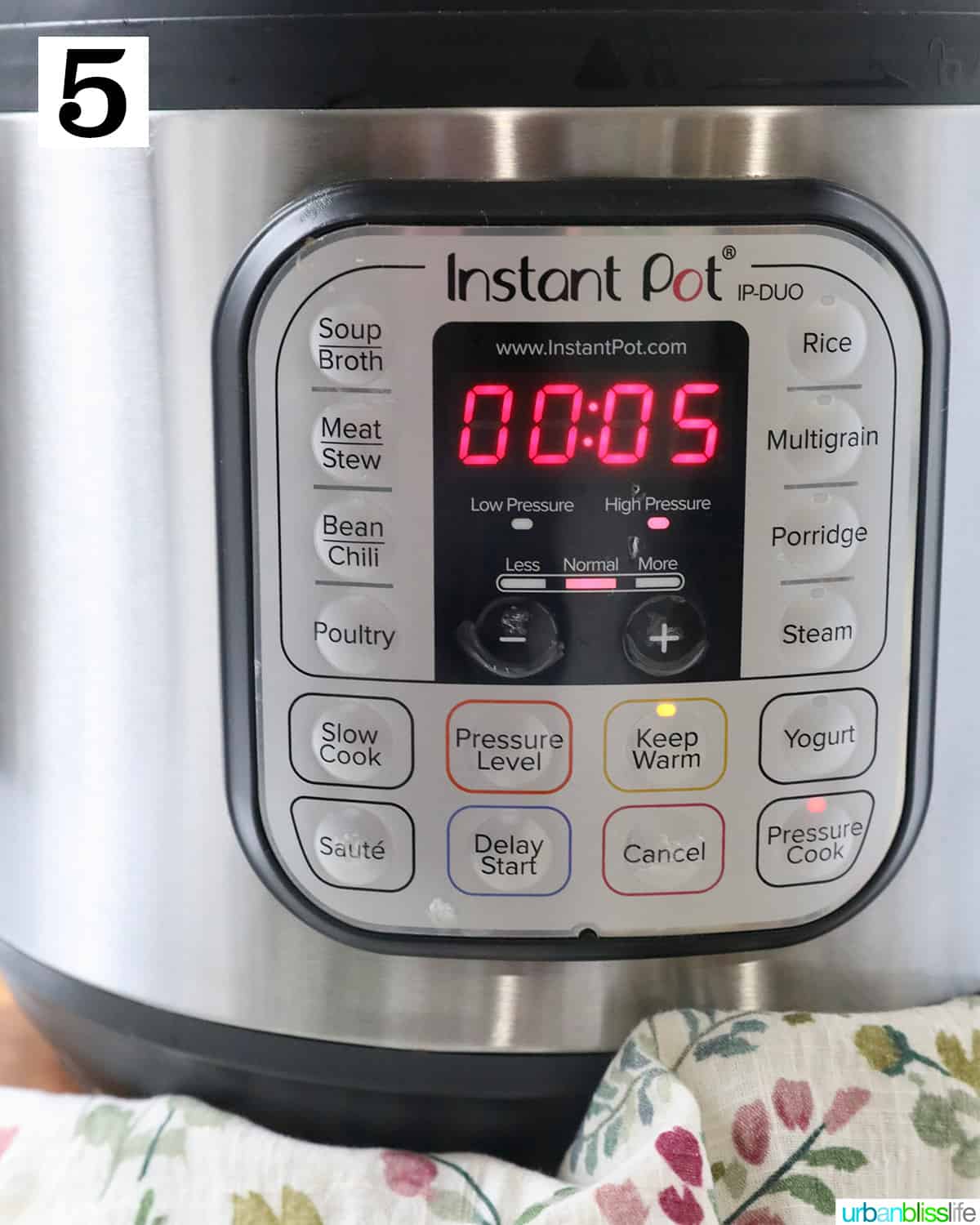 instant pot pressure cooker set to pressure cook for 5 minutes.