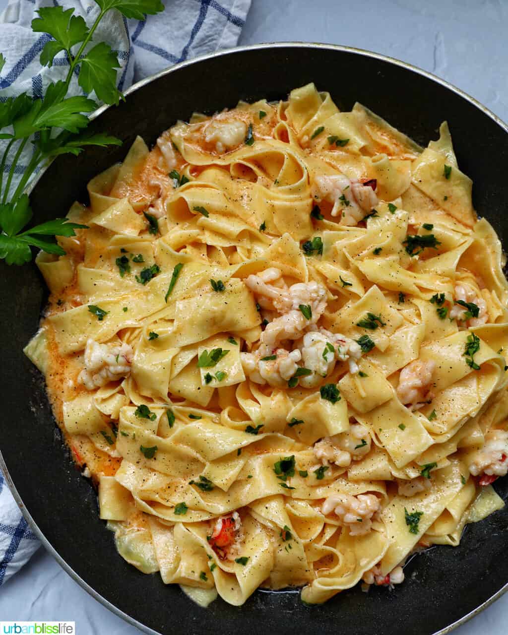 lobster with pappardelle pasta in a nonsick skillet.