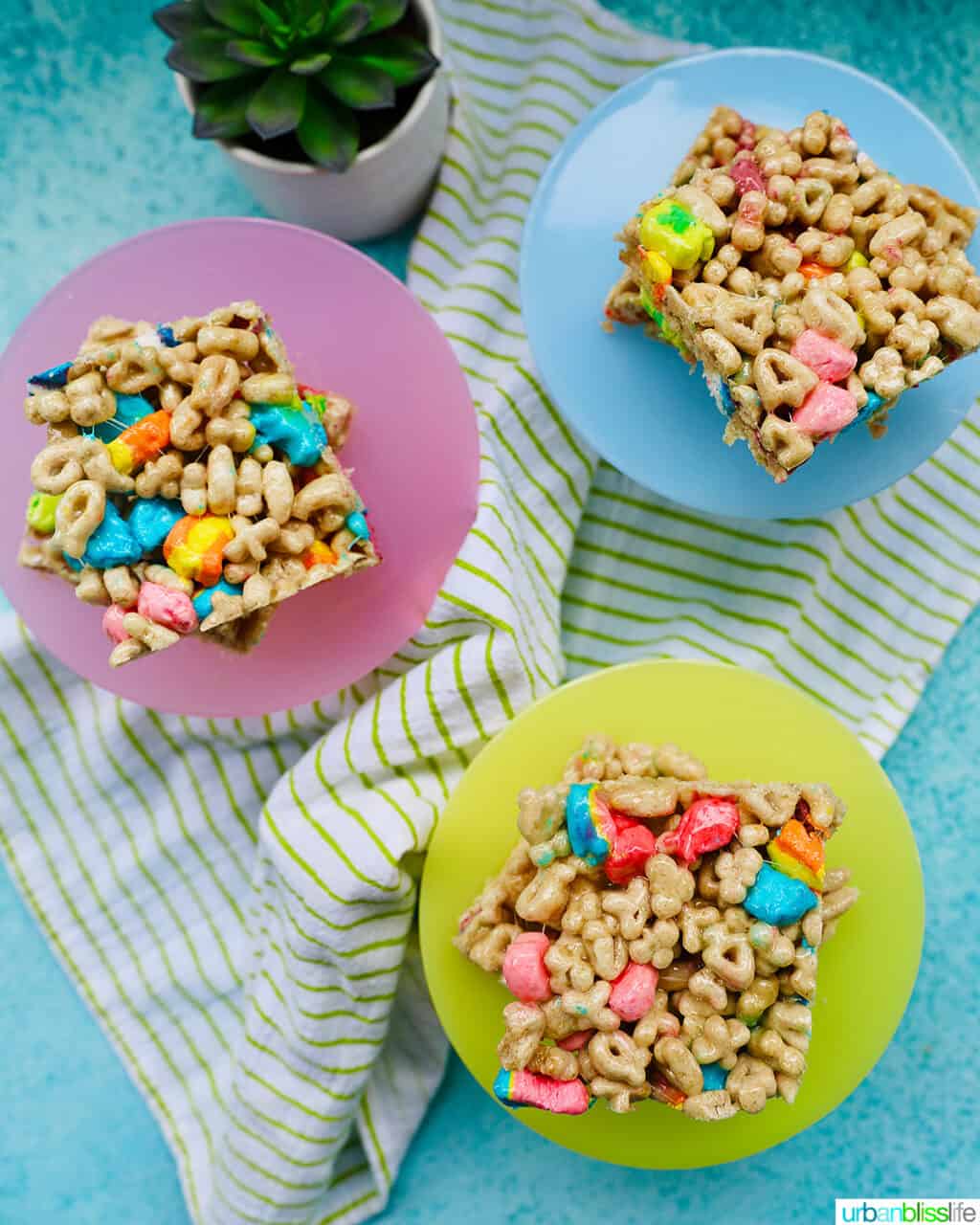 lucky charms cereal bars on different colored plates