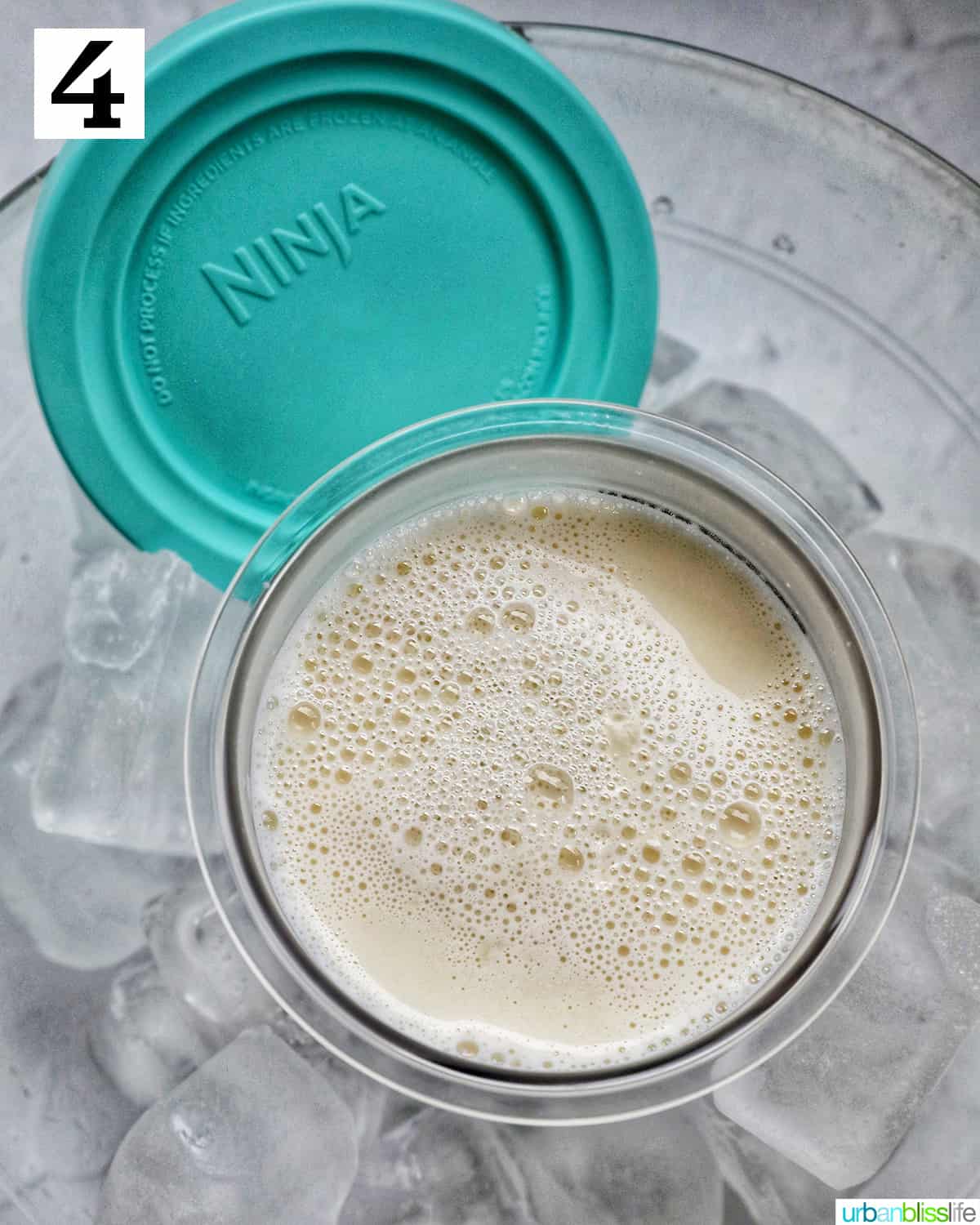 Stracciatella ice cream mixture in a Ninja Creami pint container in an ice bath.