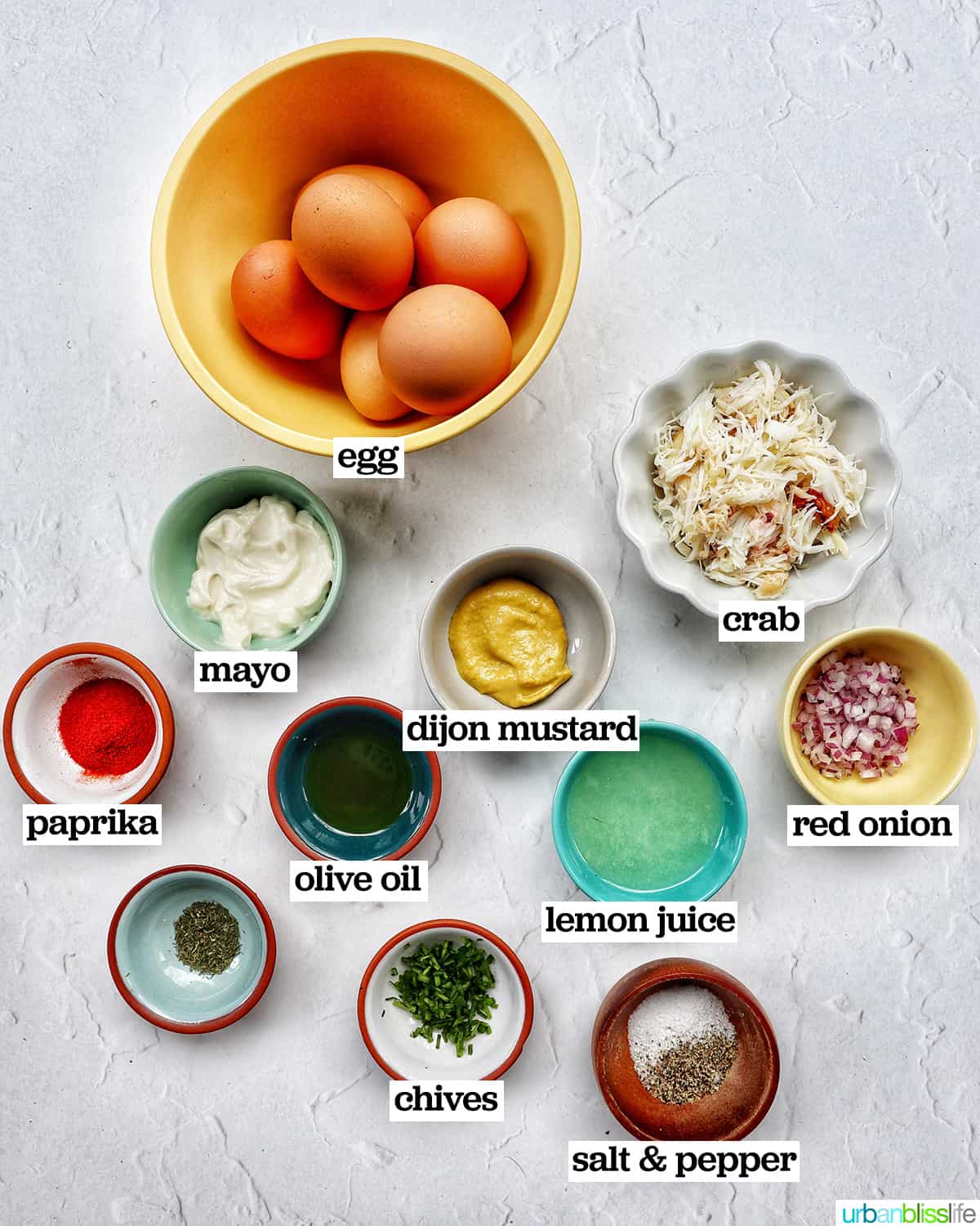 bowls of ingredients to make crab deviled eggs.