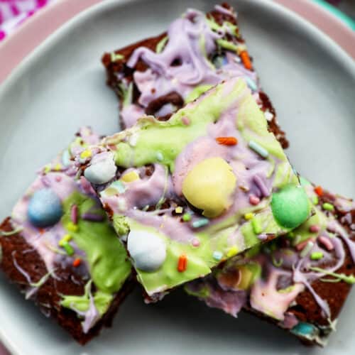 Easter brownies stacked on a plate.