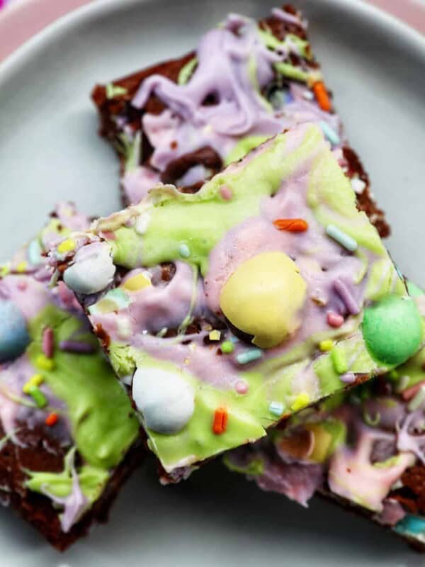 Easter brownies stacked on a plate.