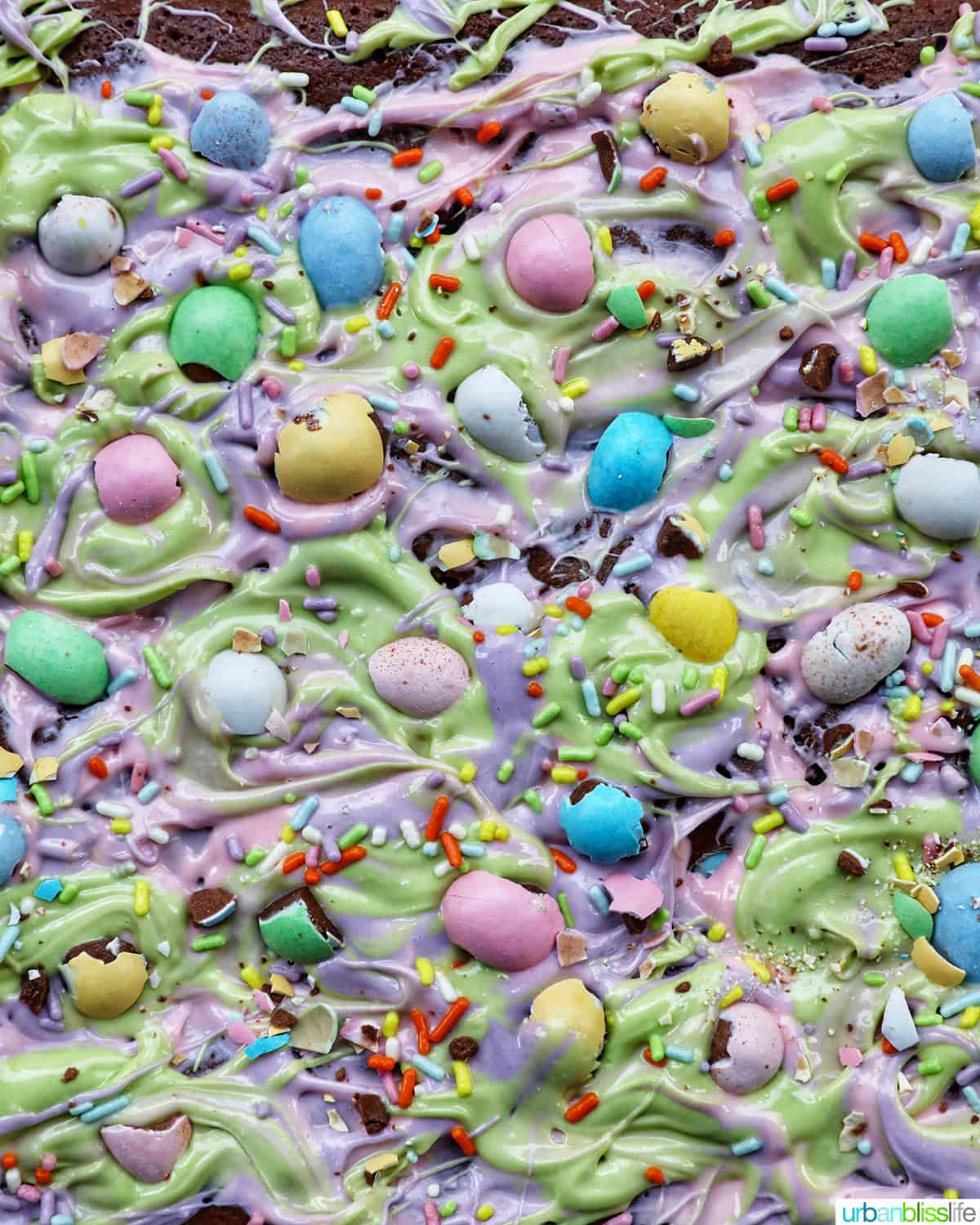 Easter brownies with colorful frosting and mini chocolate easter eggs.