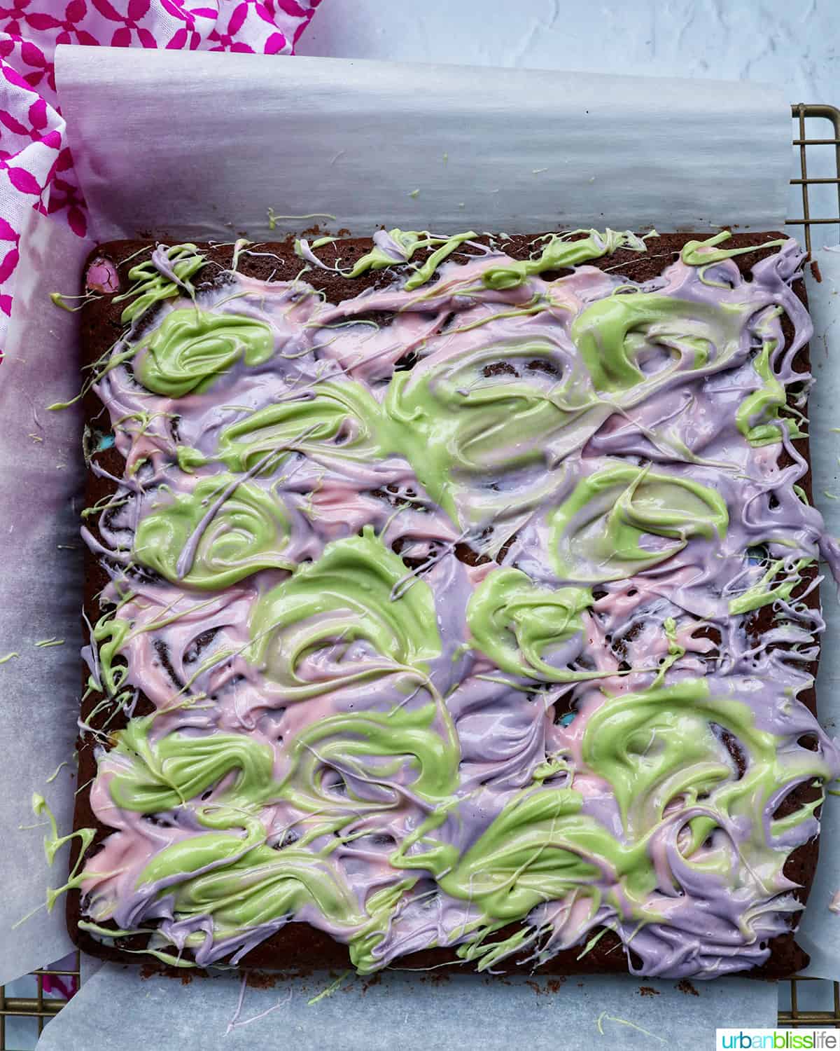 pink, green, and purple white chocolate swirled on top of easter brownies.