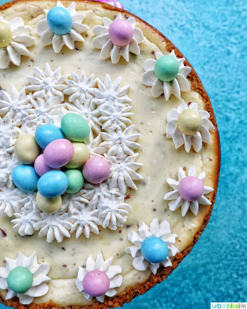 easter egg cheesecake with mini chocolate eggs and whipped cream