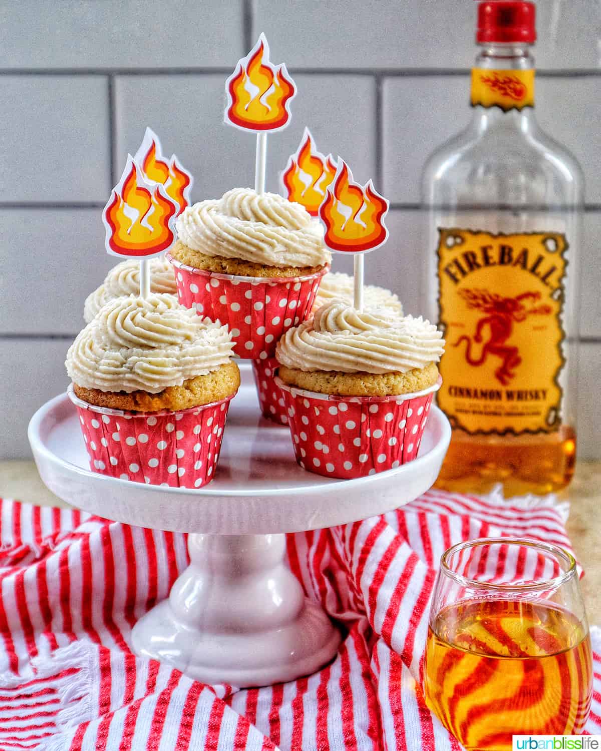 stack of fireball cupcakes with sprinkles and fire cupcake sticks.
