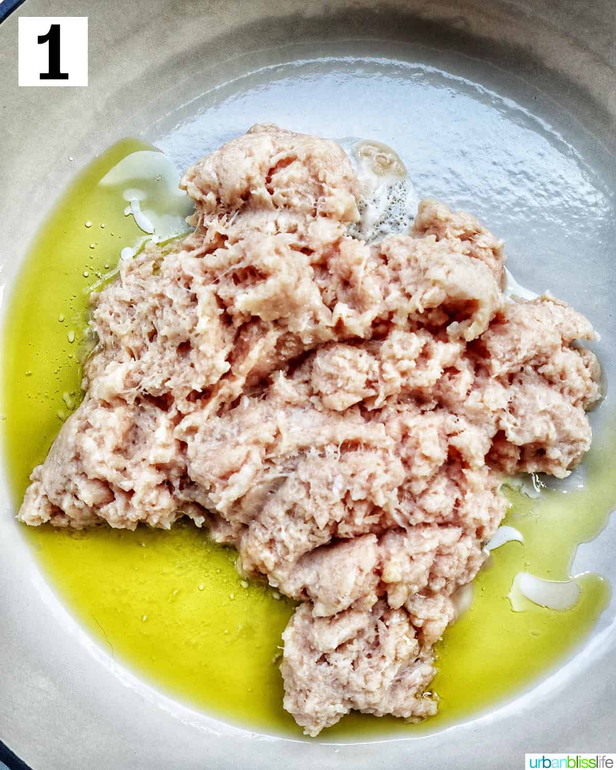 raw ground chicken and olive oil in a skillet