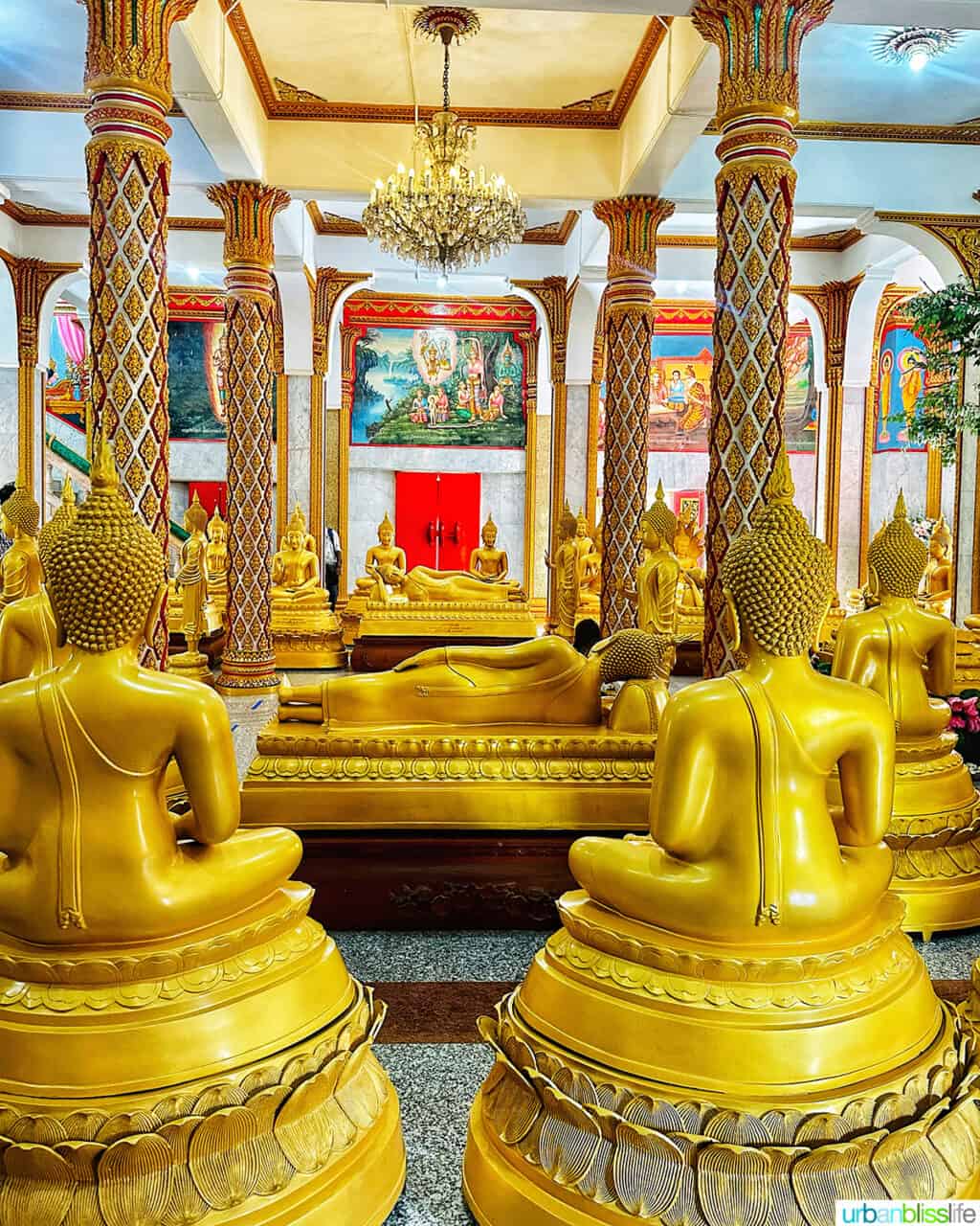 golden buddhas in the Prayer Hall of Wat Chalong Temple in Phuket Thailand.