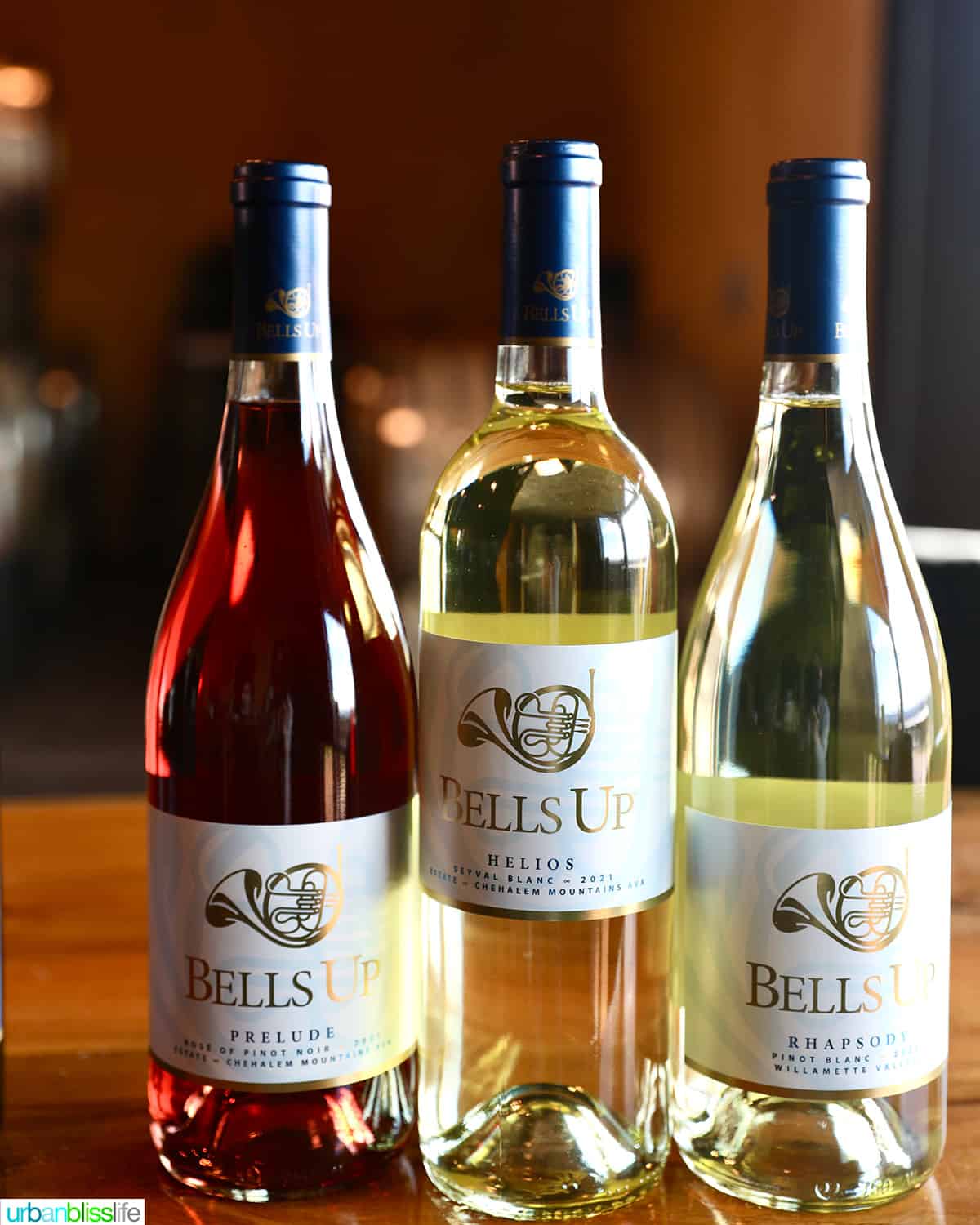 Bottle of Rosé wine, two bottles of white wines, all with Bells Up Winery labels.