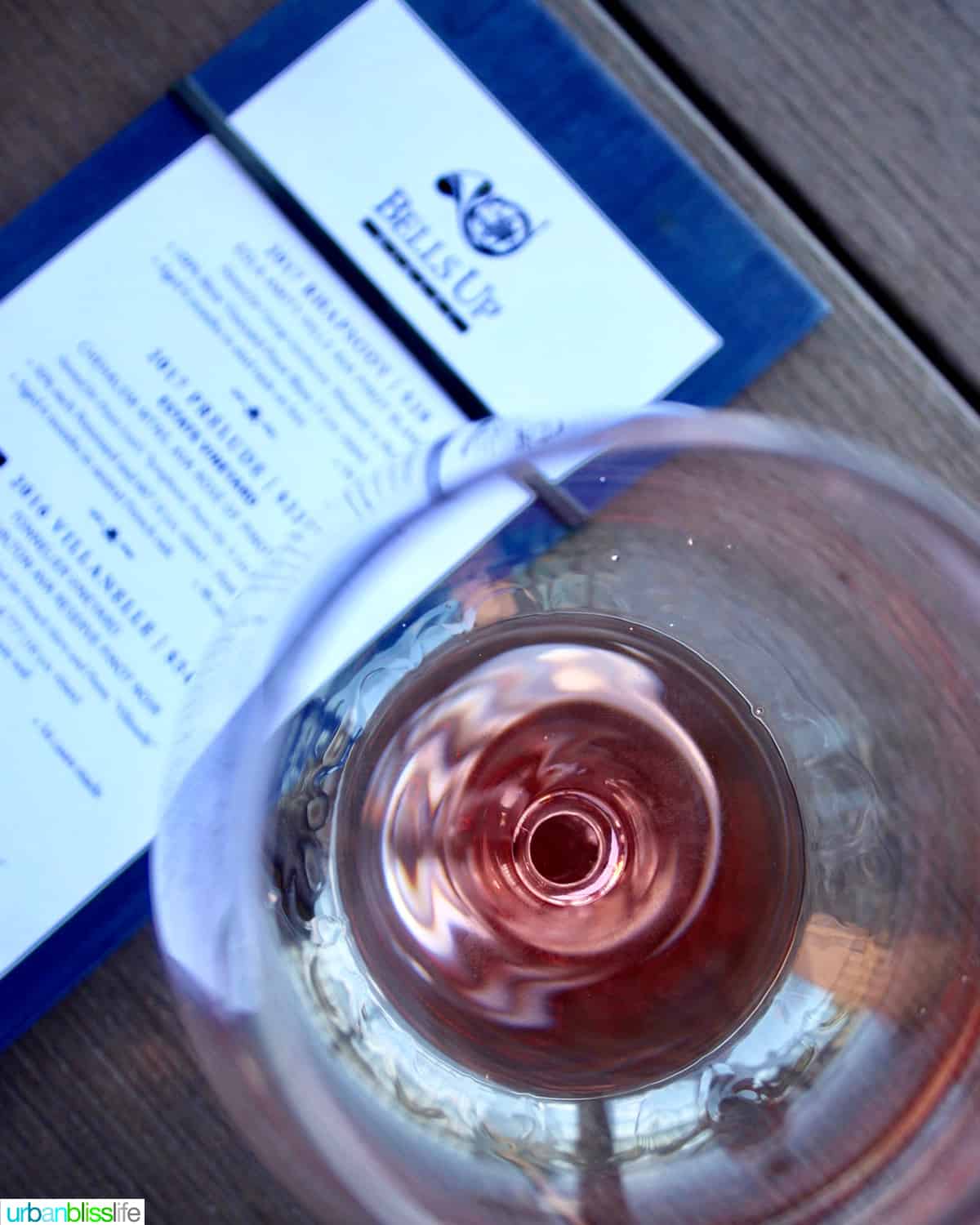 overhead photo of red wine and tasting menu.