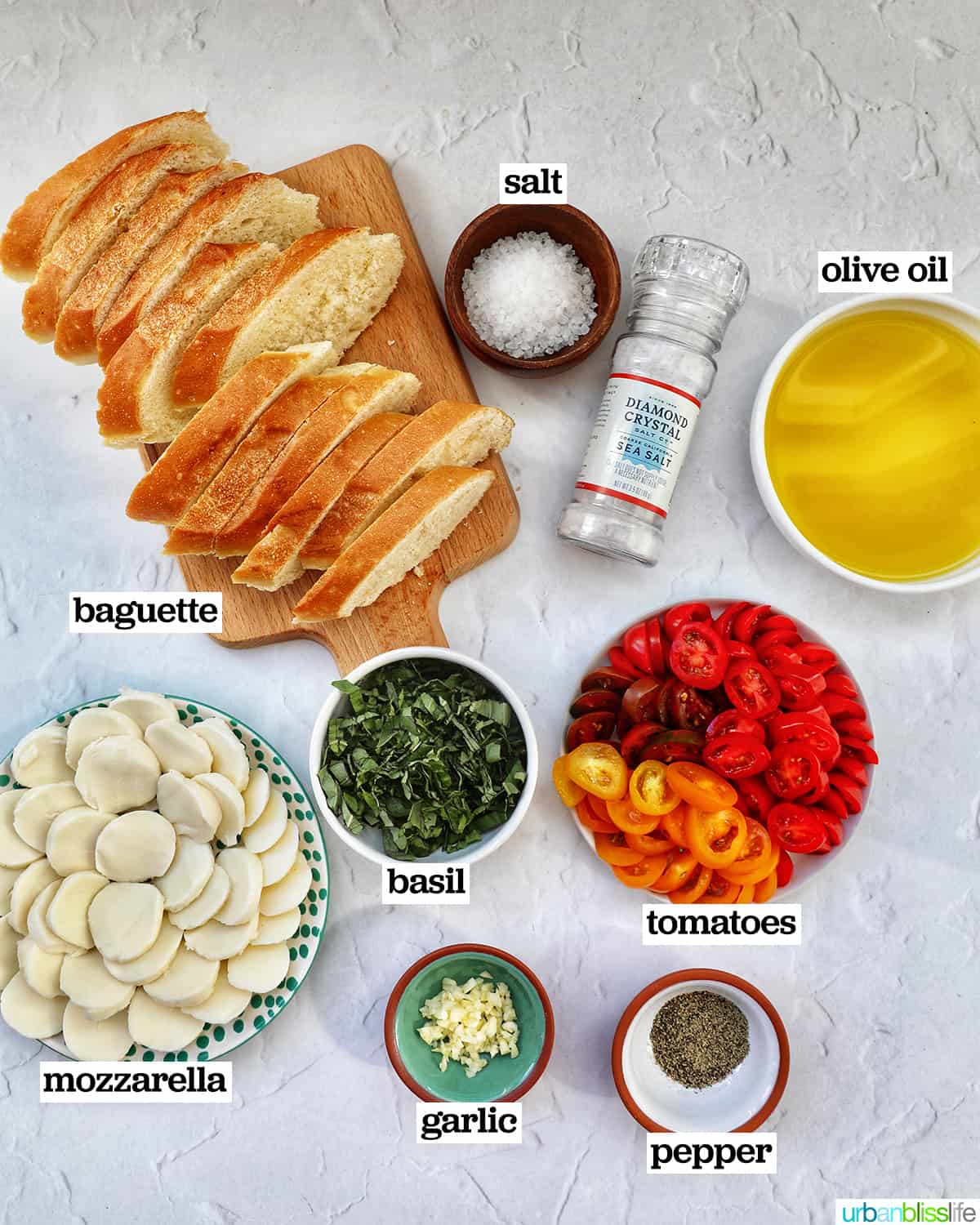 bowls of ingredients to make Caprese Crostini.