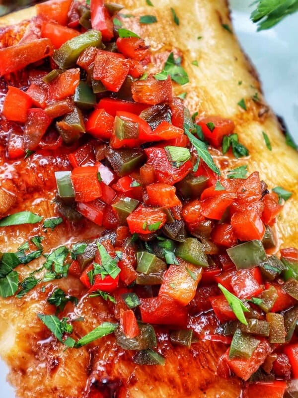 pan seared sea bass with red bell pepper and green bell pepper relish.