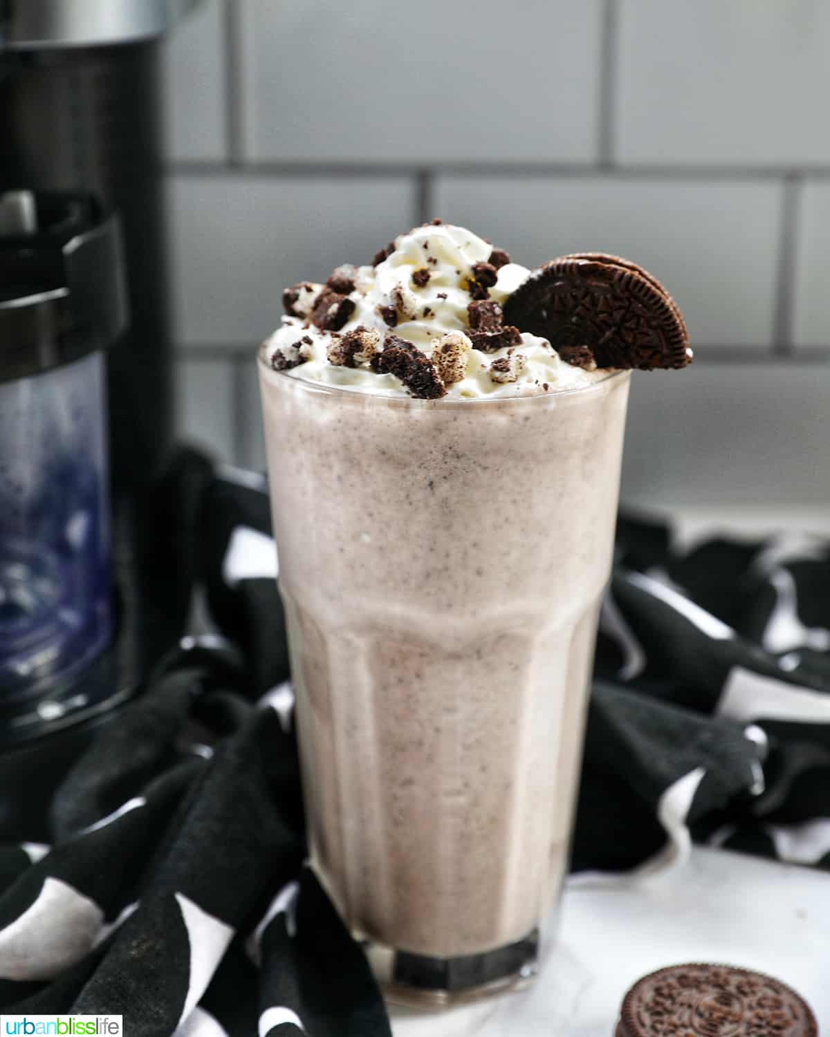 Cookies & Cream
Milkshake in a tall glass with whipped cream topping and crushed Oreo cookies on top.