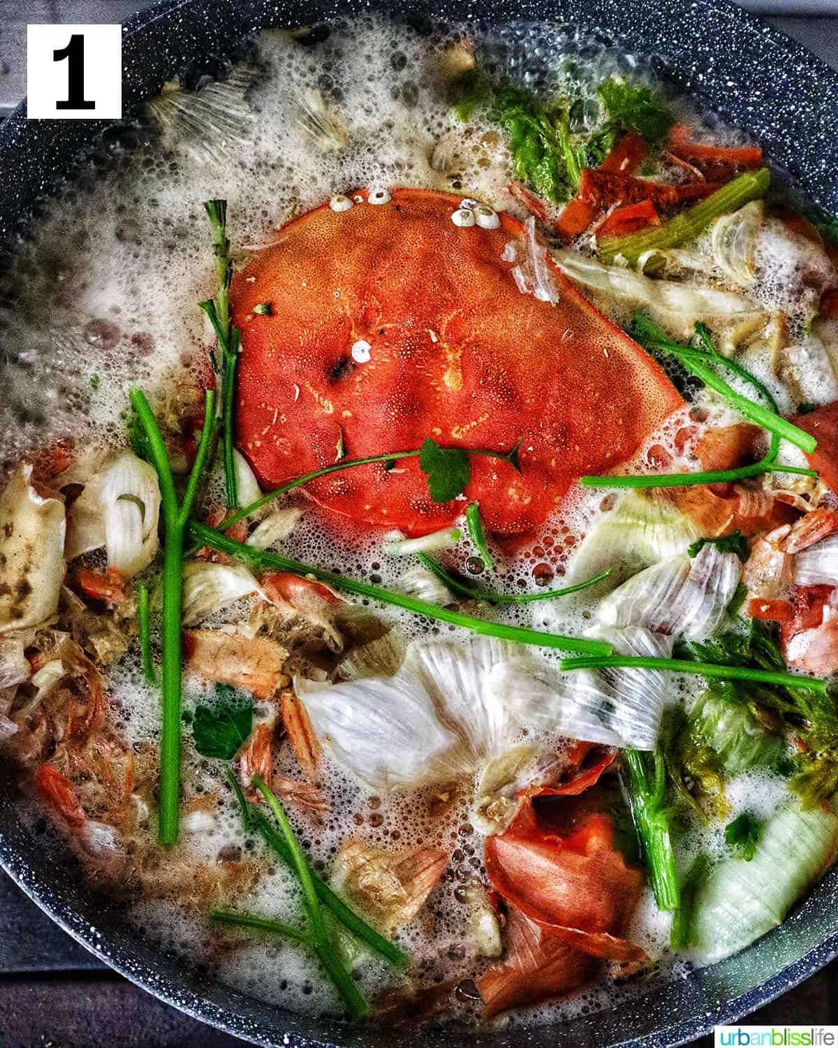 large stockpot with crab stock cooking in it.