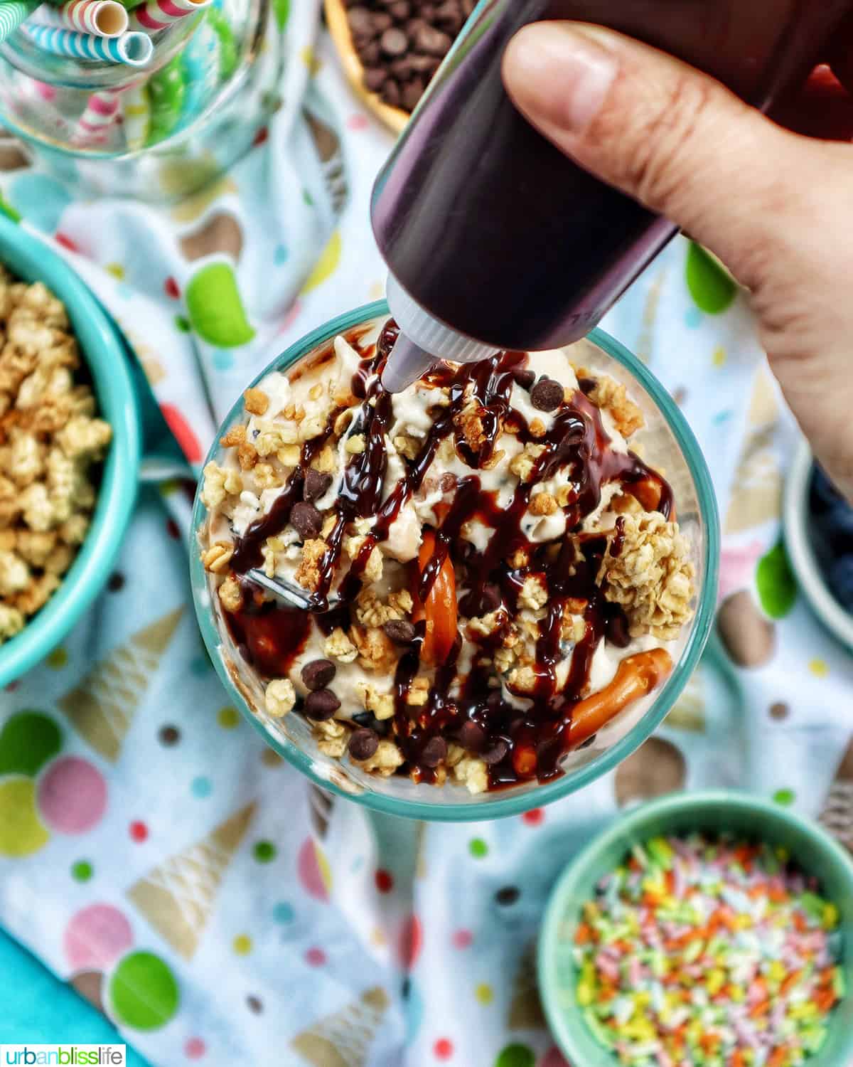 squeeze bottle of chocolate syrup over ice cream parfaits.